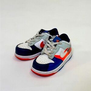 Nike Kids' White and Blue Sneakers with Orange Accents